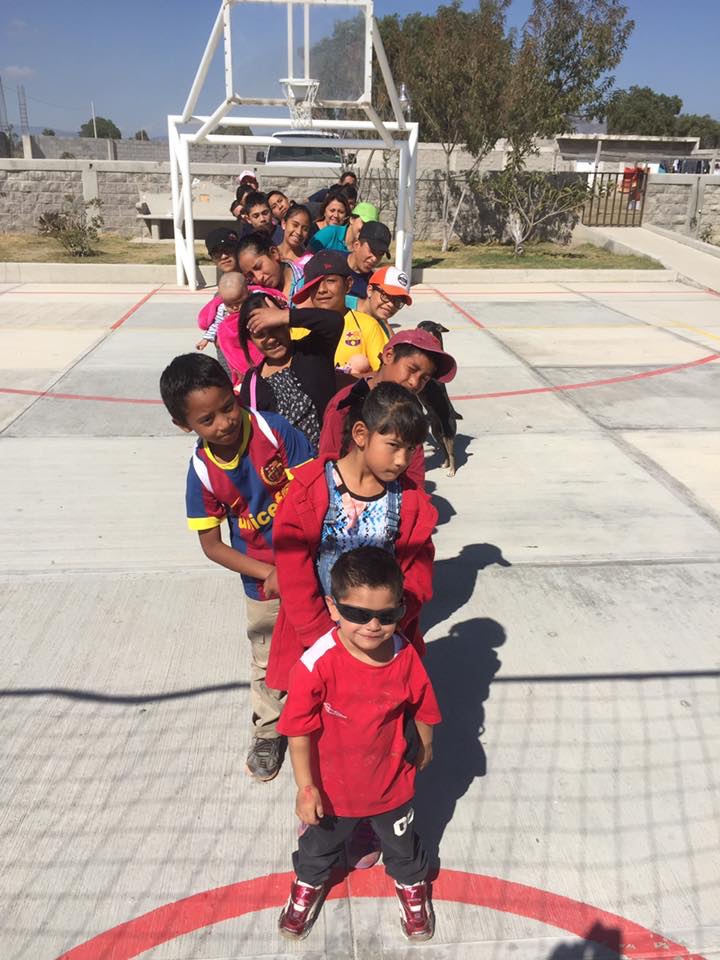 Outdoor activities on the “cancha” with the children of La Familia.  David is at the front of the line in his new “very cool” sunglasses